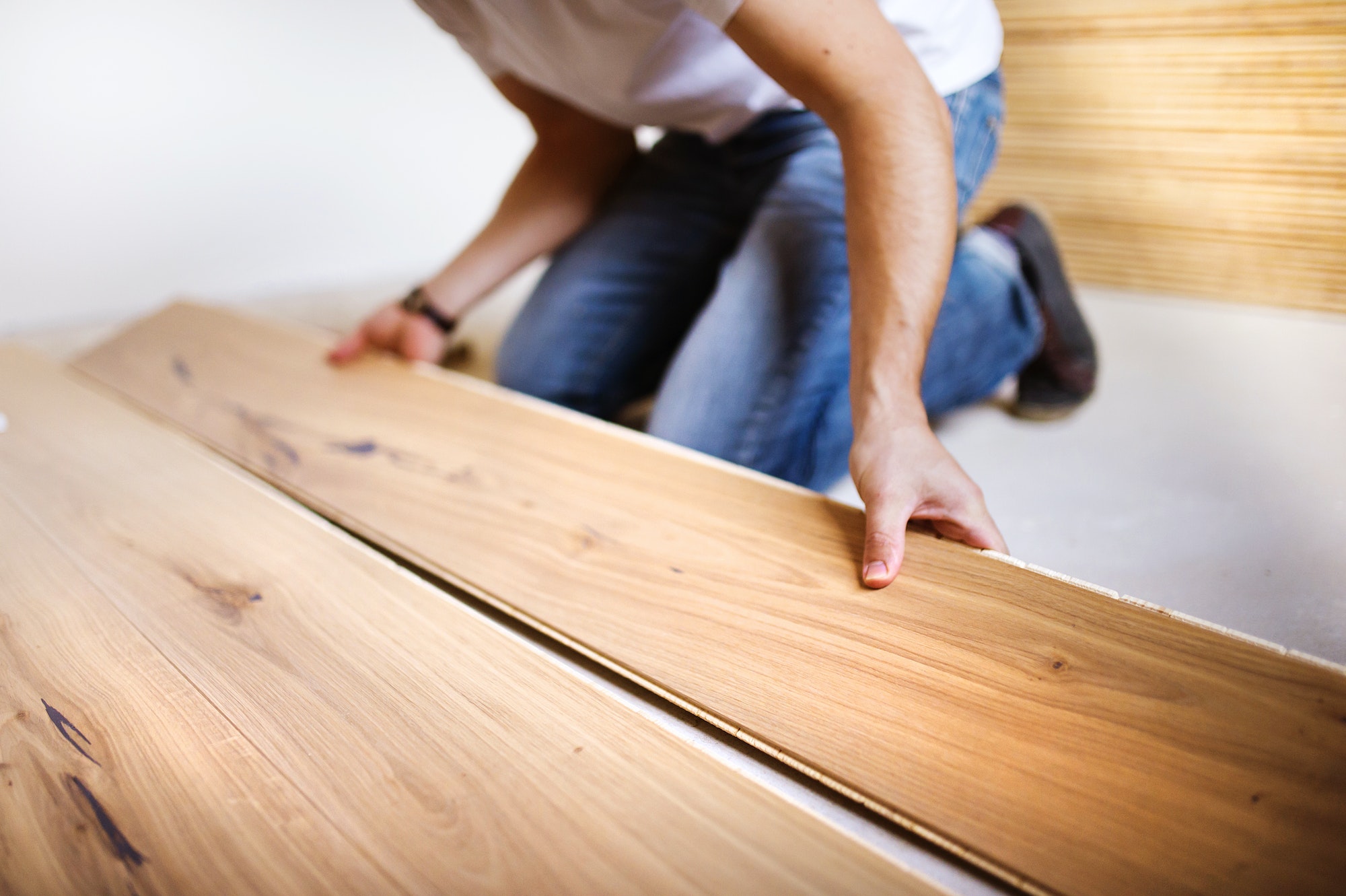 Handyman installing wooden floor